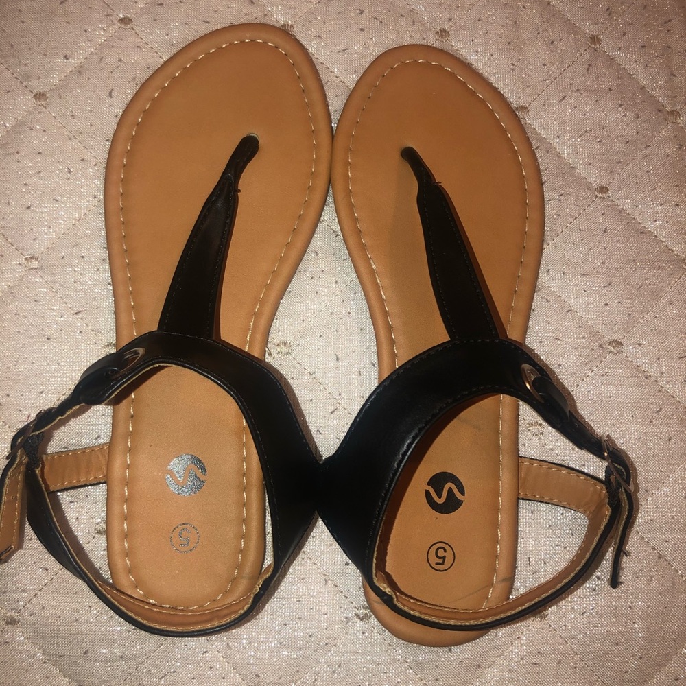 Black sandals.